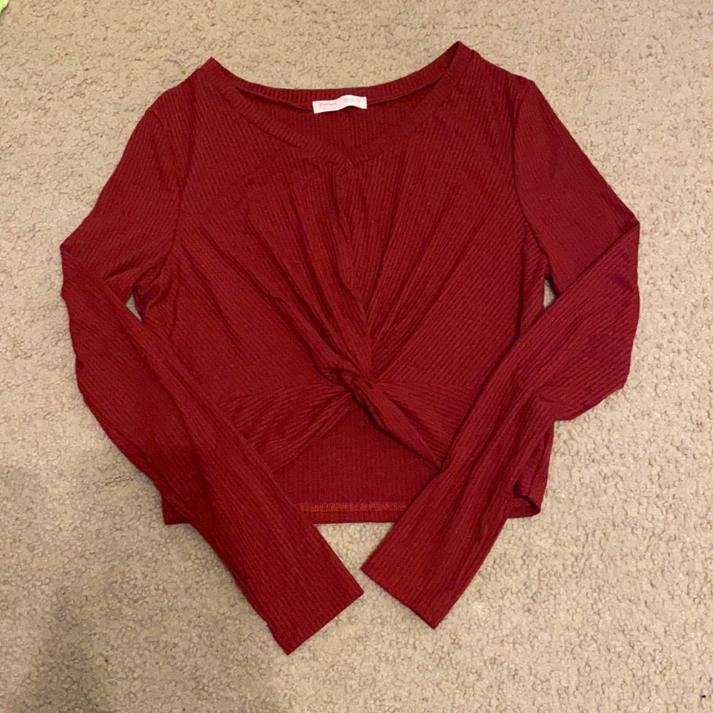red long sleeves shirt, twisted at the front